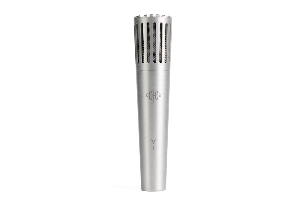 Silver metal microphone with vertical grille slots and minimal text on the body.