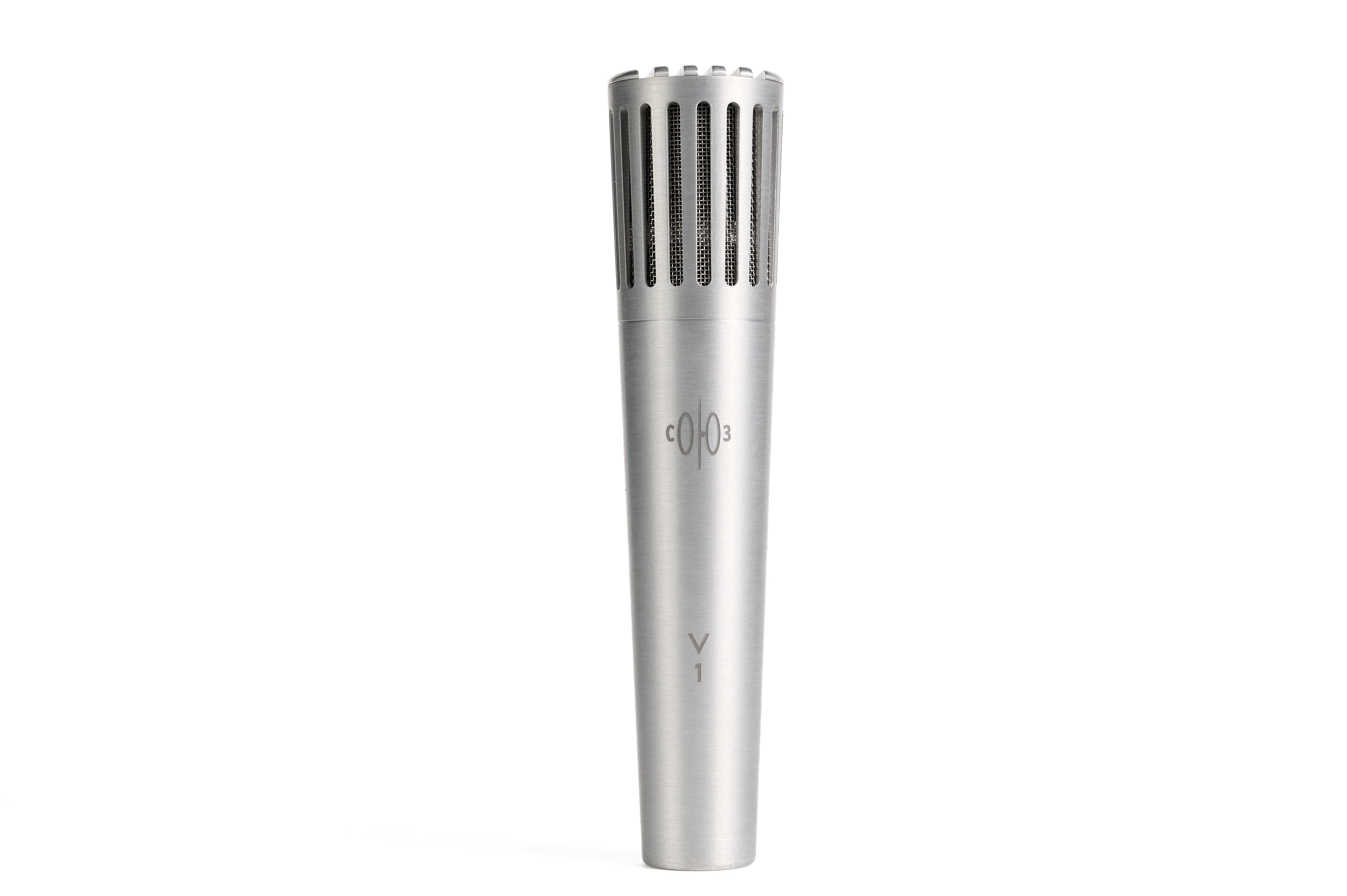 Silver metal microphone with vertical grille slots and minimal text on the body.
