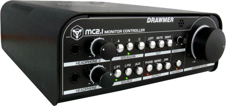 Black Drawmer MC2.1 monitor controller with multiple knobs, buttons, and two headphone jacks on front panel.