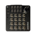 Black micro music workstation with 16 push buttons, two numeric displays, and one rotary knob.