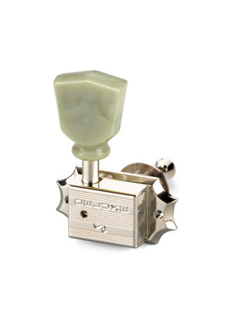 Single silver guitar tuner with cream tuning peg and DELUXE text on metal housing.