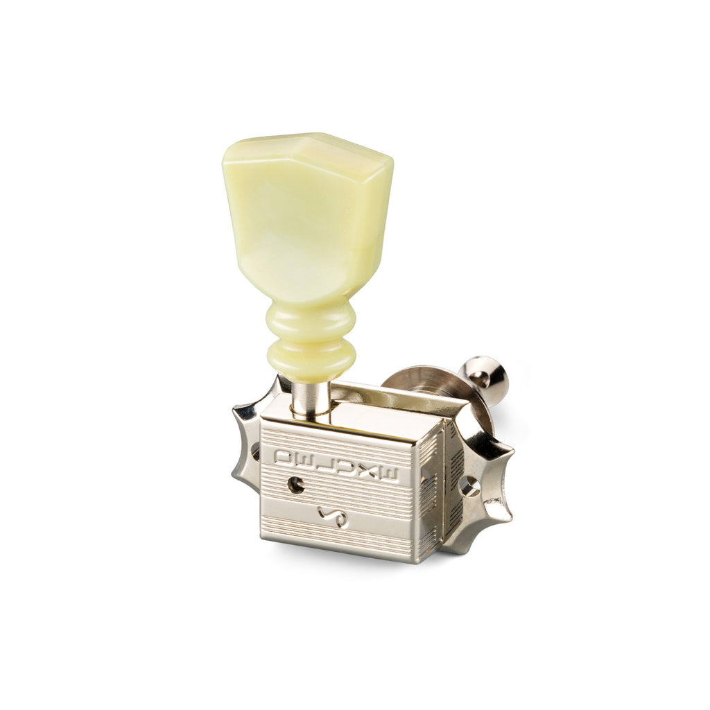 Single vintage style guitar tuning machine head with cream plastic key and metal housing.