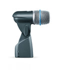 Side view of a black and silver microphone with a mesh grille and a blue ring near the grille