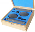 Two microphones with foam windshields and clips in a blue foam-lined wooden case.
