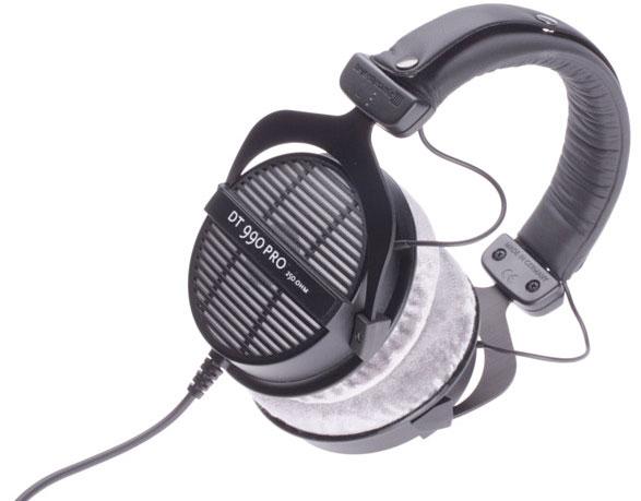 Black over-ear wired headphones with gray cushioned ear pads and adjustable headband.