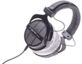 Black over-ear wired headphones with gray cushioned ear pads and adjustable headband.