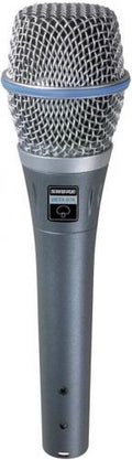 Silver handheld microphone with metal mesh grille and label reading SHURE BETA 87A