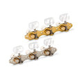 Two sets of three-string guitar machine heads with tuning pegs, one gold and one silver, on a white background.