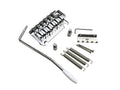 Chrome guitar tremolo bridge with whammy bar, springs, screws, and adjustment parts on white background.
