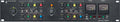 Front panel of black audio processing unit with knobs, buttons, and two analog meters for two channels.