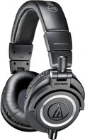 Black over-ear headphones with padded headband and circular ear cups labeled ATH-M50x.