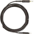 Black coiled audio cable with 3.5mm jacks on each end.