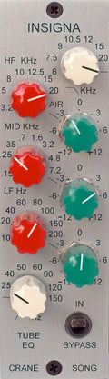 Close-up of audio processing equipment panel with labeled knobs and a toggle switch on a silver faceplate.