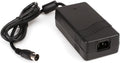 Black external power supply unit with an IEC power inlet and attached cable ending in a 5-pin DIN connector.