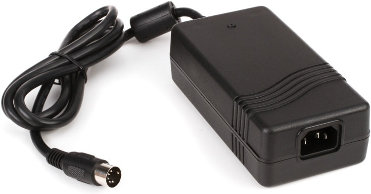 Black external power supply unit with an IEC power inlet and attached cable ending in a 5-pin DIN connector.