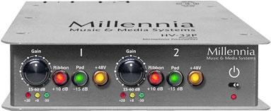 Gray audio device Millennia HV-32P with two gain knobs and multiple indicator lights on front panel.
