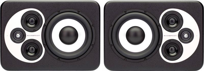 Pair of black and white studio monitor speakers with multiple drivers visible on each speaker.