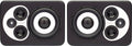 Pair of black and white studio monitor speakers with multiple drivers visible on each speaker.