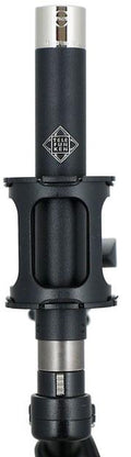 Black and silver TELEFUNKEN microphone model M62 with shock mount and XLR connector shown upright.