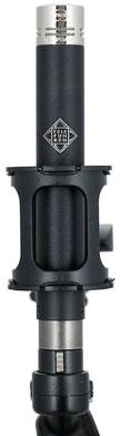 Black and silver microphone with a shock mount and TELEFUNKEN logo visible
