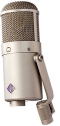 Beige studio microphone with metal mesh grille and purple diamond-shaped logo on body.