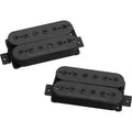 Two black Seymour Duncan humbucker guitar pickups with wire leads against a white background.