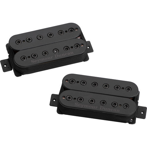 Two black Seymour Duncan humbucker guitar pickups with wire leads against a white background.