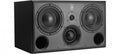 Rectangular black studio monitor speaker with two large drivers, one small driver, and two circular ports on front face.