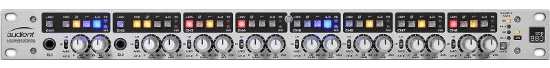 Silver audio interface device with eight channels, knobs, buttons, and digital indicators arranged horizontally.