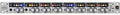 Silver audio interface device with eight channels, knobs, buttons, and digital indicators arranged horizontally.