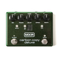 Green MXR Carbon Copy Deluxe guitar effects pedal with knobs, buttons, and footswitches.