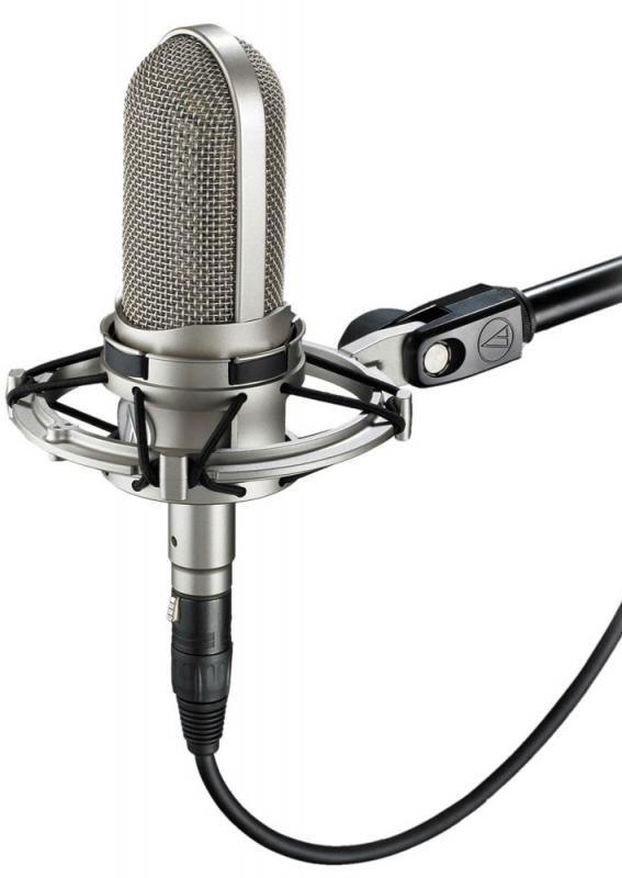 Silver condenser microphone with shock mount attached to a mounting arm with cable connected.