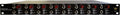 Black 8-channel audio device with multiple 6.35mm input jacks and red rotary knobs on front panel.