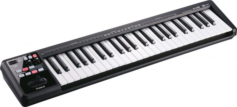 Black MIDI controller keyboard with white and black keys and various buttons and joystick controls on left side.