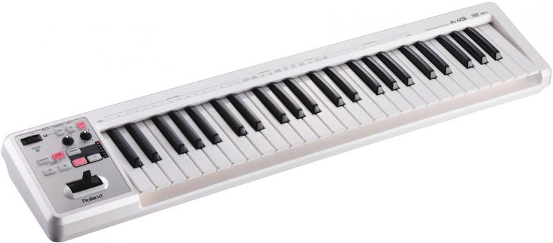 White MIDI keyboard controller with black and white keys and various control buttons and knobs on the left side.