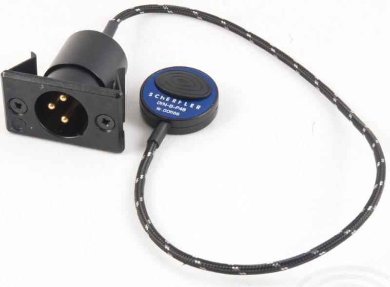 Black circular pickup sensor with SCHERTLER DYN-B-P48 label attached to fabric-covered cable and 3-pin male XLR connector with mounting plate.