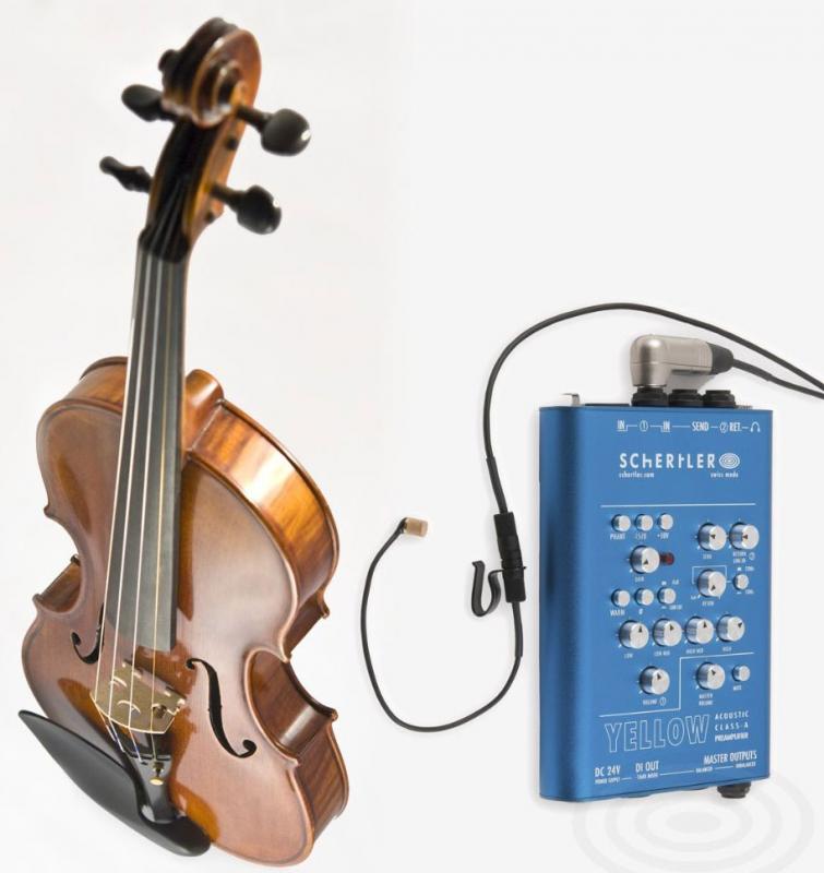 Brown violin and blue Schertler Yellow acoustic preamplifier with cable and clip on white background.