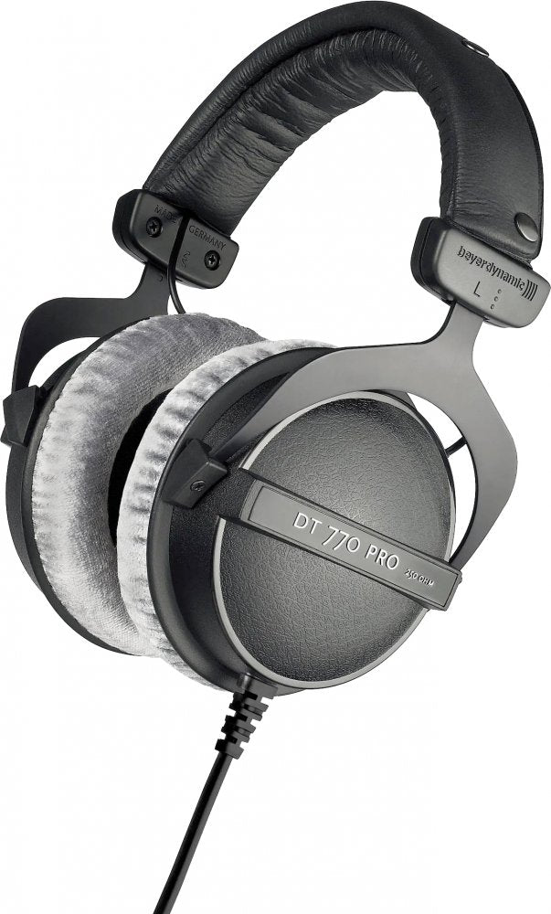 Over-ear black and gray headphones with fabric ear cushions and a coiled wired cable.