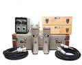 Two silver microphones, cables, shock mount, and cases including wooden and hard case shown on white background