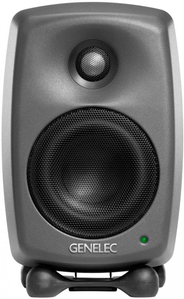 Front view of a gray studio monitor speaker with black speaker grilles and a green indicator light.