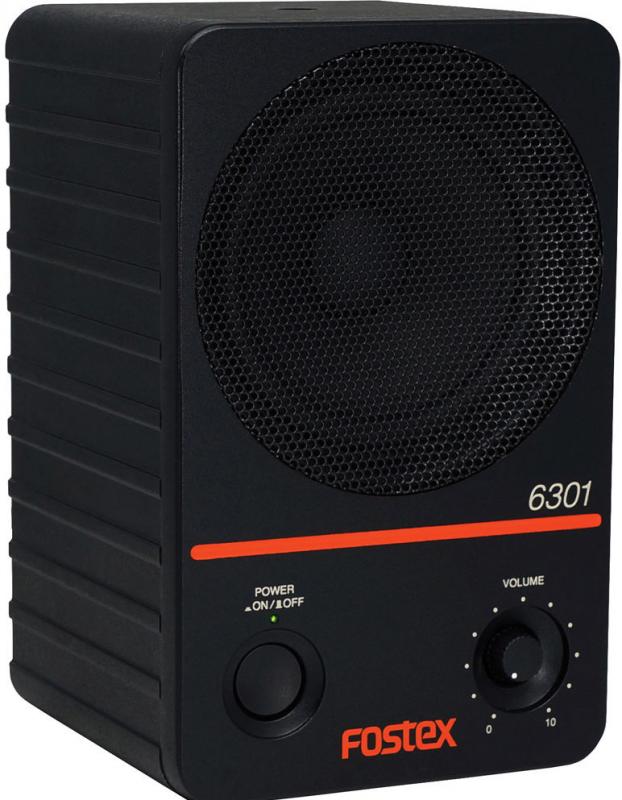 Black rectangular speaker with metal mesh grille, power button with indicator light, and volume knob.