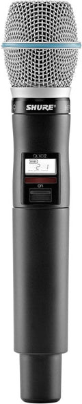 Black and silver wireless handheld microphone with a mesh grille and LCD screen displaying channel 21.