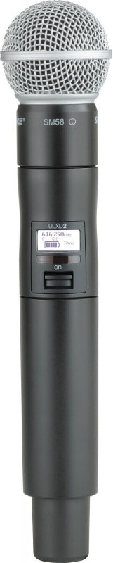 Black wireless handheld microphone with silver mesh grille and visible power switch and display.