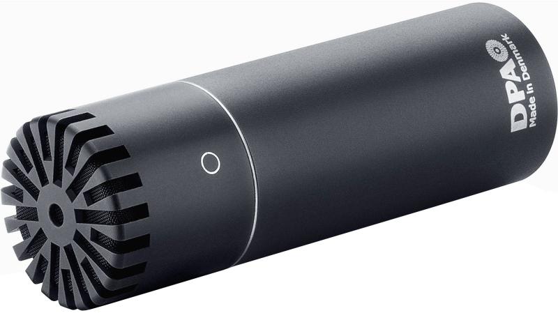 Black cylindrical microphone with grille front and DPA branding lying on its side.