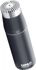 Black and silver microphone with a circular vented grille top and DPA branding at the bottom.