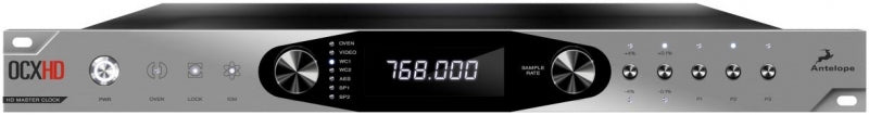 Front view of a black and silver Antelope OCX HD master clock with display, knobs, buttons, and a headphone jack.