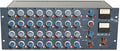 Front panel of a Heritage Audio MCM 20.4 mixer with rows of knobs, switches, and two VU meters.