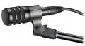 Black dynamic microphone labeled ATM230 hypercardioid with attached XLR cable and microphone clip.