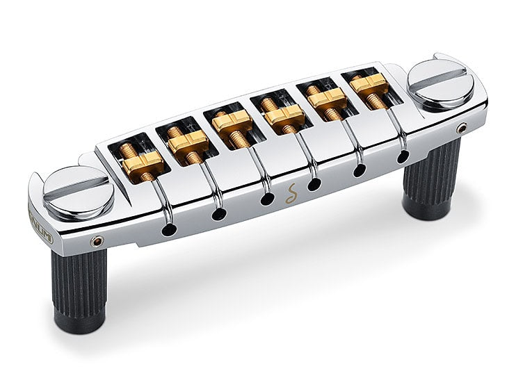 Chrome guitar bridge unit with six adjustable saddles and two mounting posts.