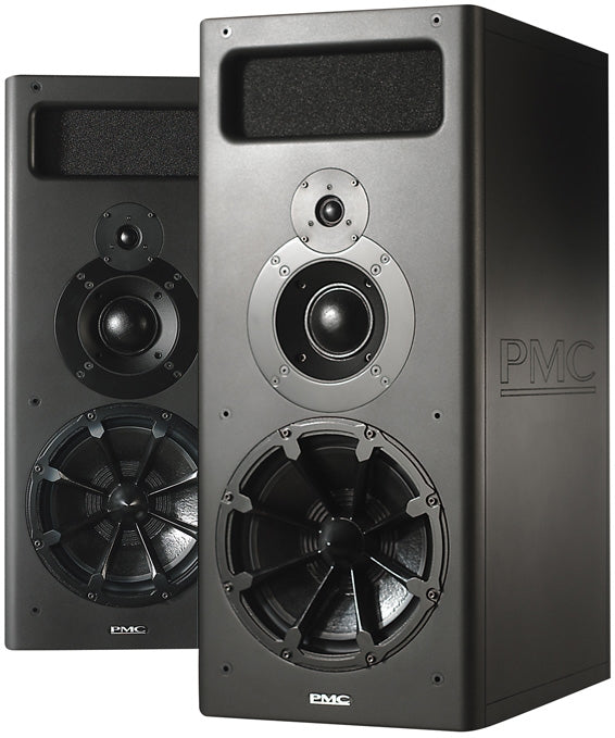 A tall, upright rectangular PMC MB2S passive studio monitor in a dark cabinet, with a three-way driver array on the front baffle: a large low-frequency cone driver, a smaller midrange dome, and a tweeter above it.